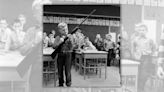 Fact Check: Photo Purportedly Shows Young Child Holding a Gun in Safety Class in 1956. Here Are the Facts