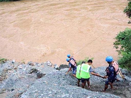 Nepal authorities say 65 people were on board buses that fell in river