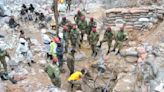 Rescuer raises hope of survivors at a Zambian mine where more than 30 have been buried for days