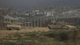 Israeli strikes across Gaza kill more than 30 as the sides weigh the latest cease-fire proposal