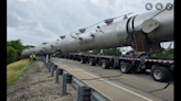 Two killed when 350,000-pound load falls off trailer on highway, Texas officials say