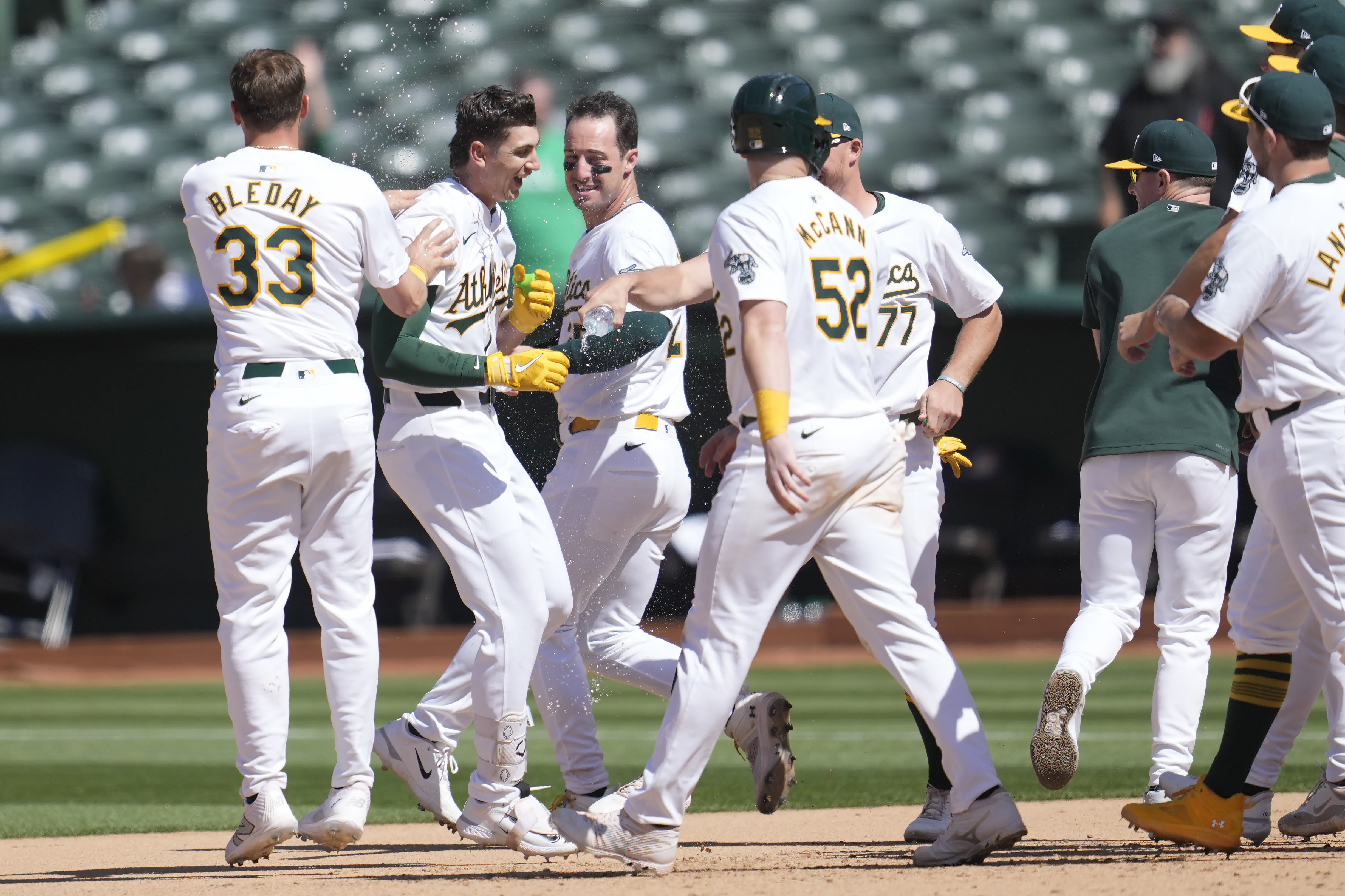 A's hit 2 tying homers in late innings and score 5 runs in 11th to rally past Rockies 10-9