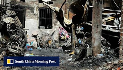 ‘Explosions like firecrackers’: fire engulfs building in Hanoi, killing 14