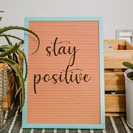 Motivational messages or quotes printed on a decorative sign, providing a daily dose of positivity and encouragement.