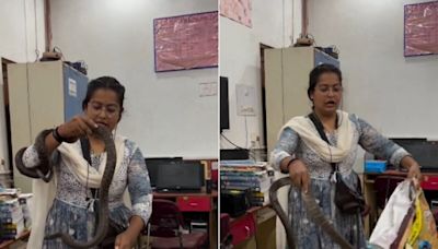 Watch: Chhattisgarh Woman Bravely Rescues Snake Hiding In Office With Bare Hands