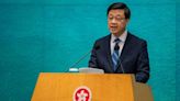 Hong Kong leader hits out after UK charges three with spying for city