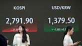 Stock market today: Asian stocks are mixed after Wall Street edges to more records