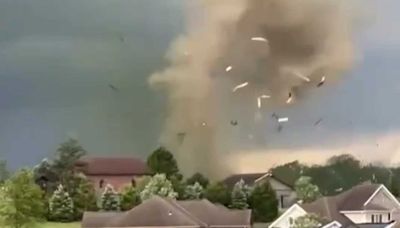 Tornado forms as debris is thrown into the air in Washington County