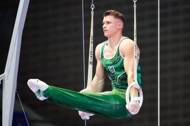 Gymnastics world champion Dauser picked for Olympics despite injury