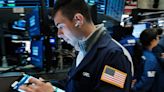 Stocks mixed while Nasdaq sinks amid new economic warnings: Stock market news today