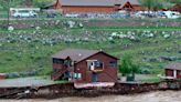 Video shows large home slipping into river and floating away amid historic Yellowstone flooding