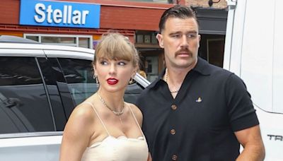 Taylor Swift attends New York wedding wearing cream floral dress with Travis Kelce