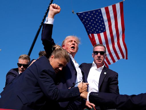 Photo of bloodied Trump fist pumping immediately spotlighted by his allies