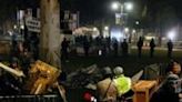 Tents and barricades were dismantled and protesters led away from the University of California, Los Angeles in an all-night operation