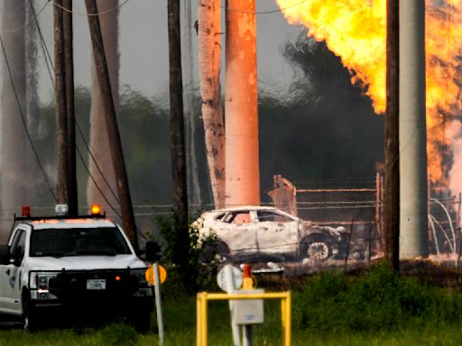 Roaring pipeline fire near Houston subsides but still burns