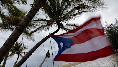 Ernesto slams Puerto Rico with heavy rain and strong winds, causing mass power outages