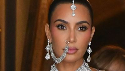 Kim Kardashian dazzles in an extravagant look at £250m wedding