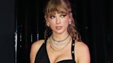 Taylor Swift Arrives at the VMAs in a Slinky Black Dress and Layers of Gold Jewelry