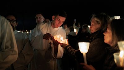 Catholic pilgrims at Fatima shrine pray for the end of multiple wars