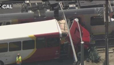 USC bus collides with Metro Rail train, firefighters set up triage areas for injured train passengers