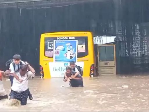 VIDEO: Traffic Cop, Local Heroes Rescue Children From School Bus Trapped In Flooded Underbridge In MP