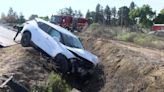 Woman hits power pole, crashes into stop sign, ends up in Fresno County canal