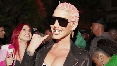 Incomparable Clownery: Disappointing Dorito Endorser Amber Rose Adorns Herself In Donald Trump-Themed Jewelry