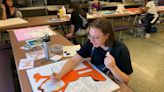 These Garfield HS students painted ceiling tiles to cheer up young hospital patients