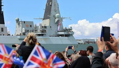 Warship returns after landmark trip - but helicopter issue means defence secretary misses the action