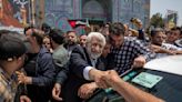 Reformist candidate narrowly leads hard-liner in early results from Iran’s election, state TV says