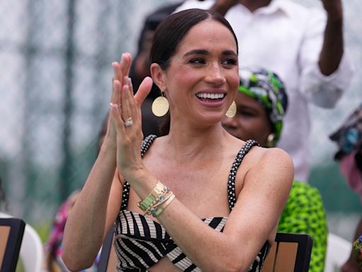 Meghan Markle's diamond cross necklace, allegedly from Princess Diana's collection, under scrutiny after Nigeria visit