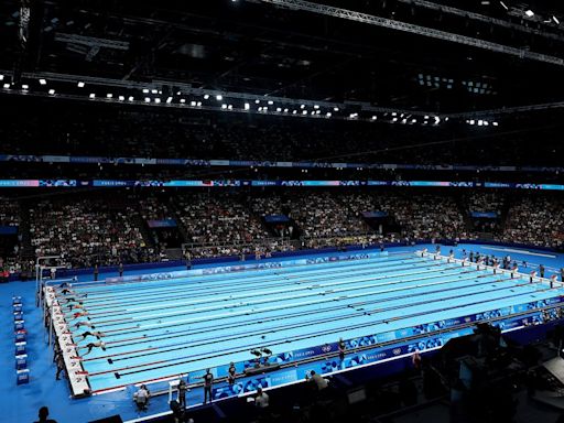 Man In Speedo Named 'Bob The Cap Catcher' Wins Hearts At Olympic Swim Competition