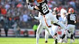 Browns: Denzel Ward gives a fan a souvenir at Guardians game on Tuesday