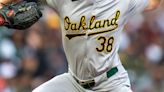 A's bash four home runs, cruise to win over Giants