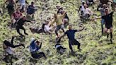 Tall Tales: thousands slip in Gloucestershire cheese-rolling race