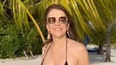 Liz Hurley stuns as she parades ageless physique in tiny black bikini on holiday