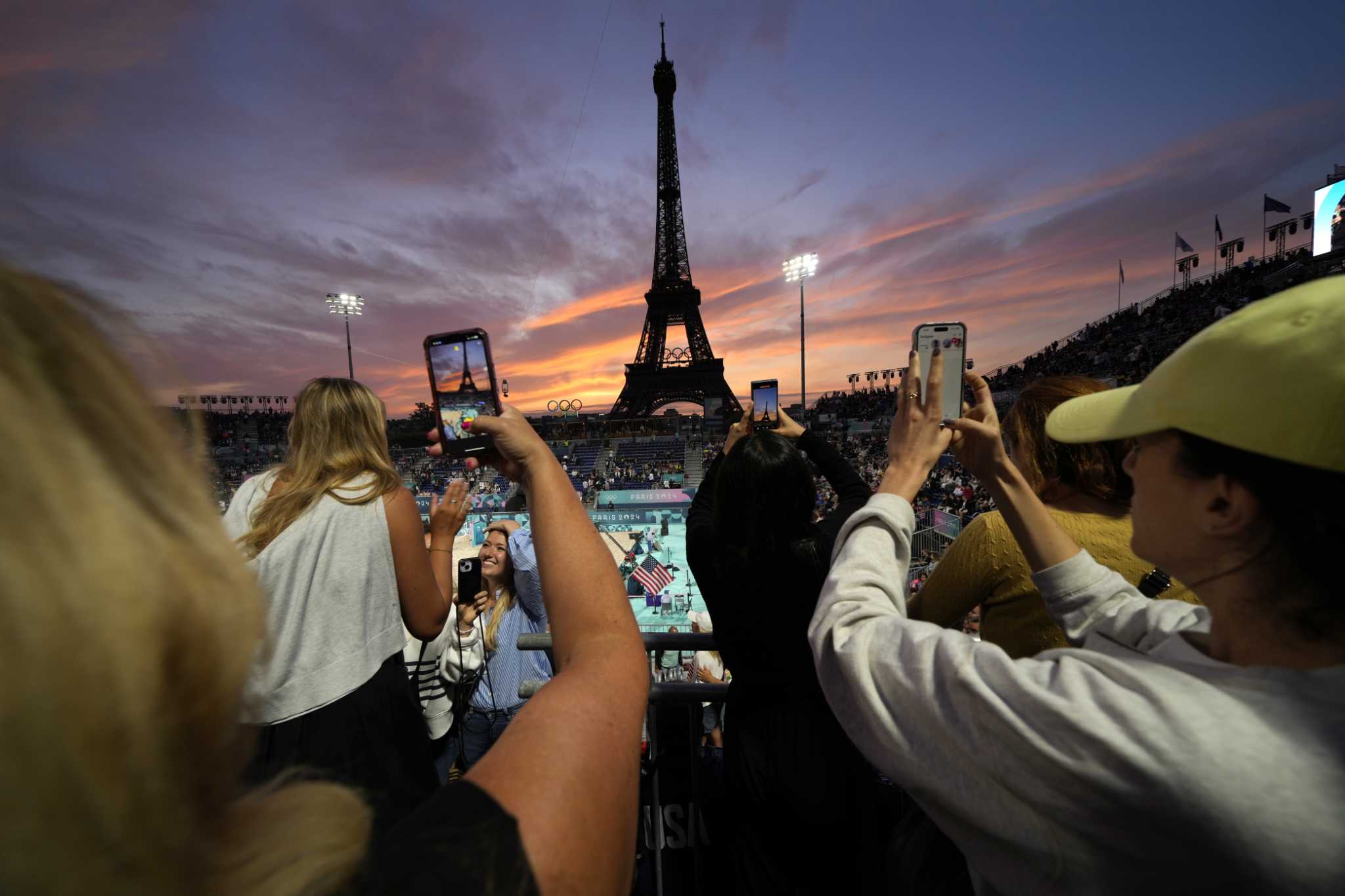 Beach volleyball at Eiffel Tower stadium draws the crowds looking for the perfect social media post