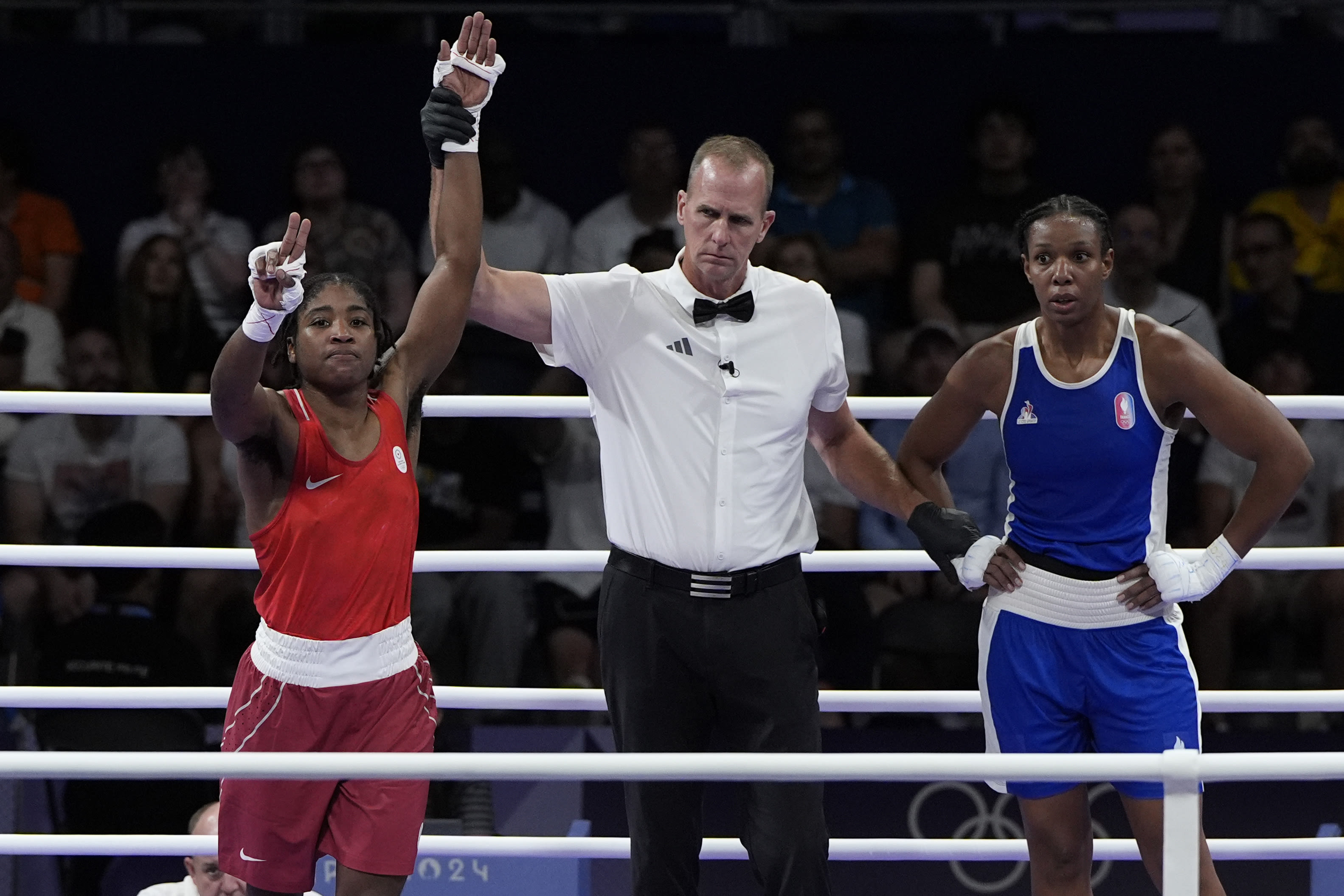 Boxer Cindy Ngamba is the refugee team's first athlete to clinch a medal at the Paris Olympics