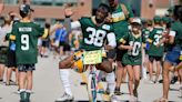 2025 NFL Draft borrowing from Packers tradition with bicycle handoff from Michigan to Wisconsin