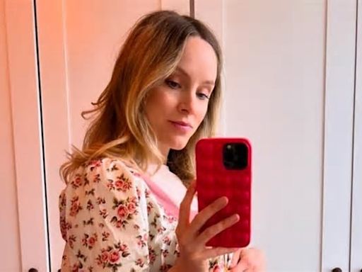 Peaky Blinders star Sophie Rundle cradles her blossoming bump after revealing she is expecting her second child