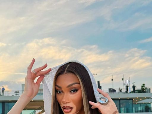 Winnie Harlow Shuts Down The White Party in a transparent Cowl-Neck Dress