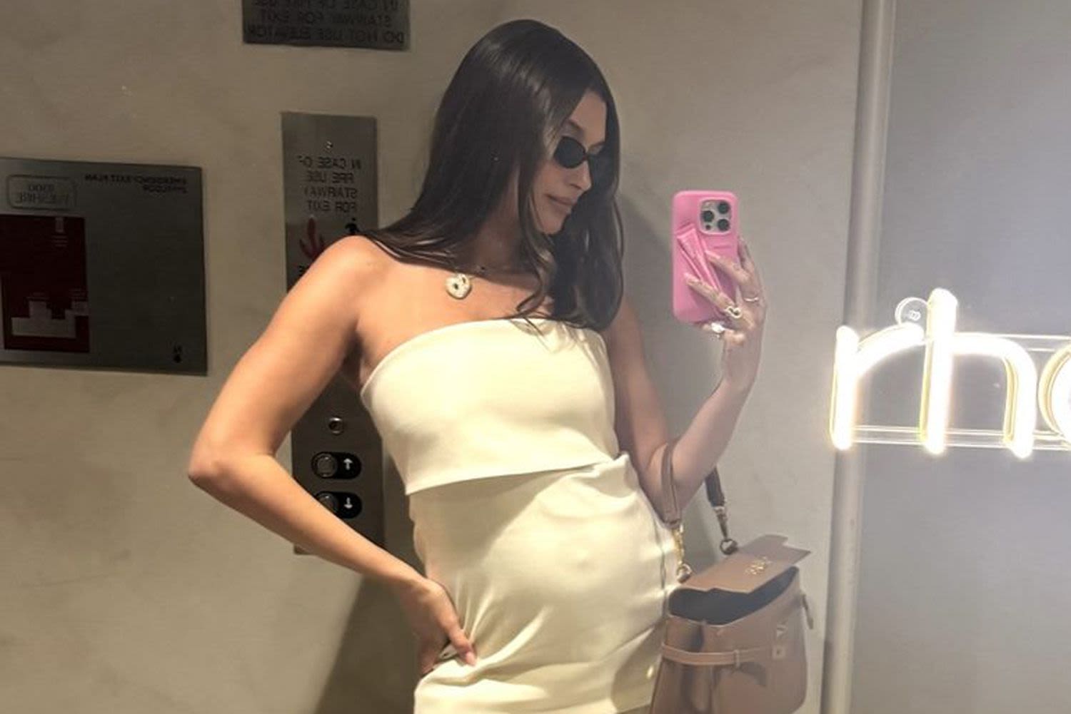 Pregnant Hailey Bieber Bares Her Bump in Sheer Skin-Tight Gown as She Shares 'Some Bits'