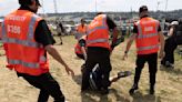 Moment Glastonbury guards tackle man who tried to gatecrash festival