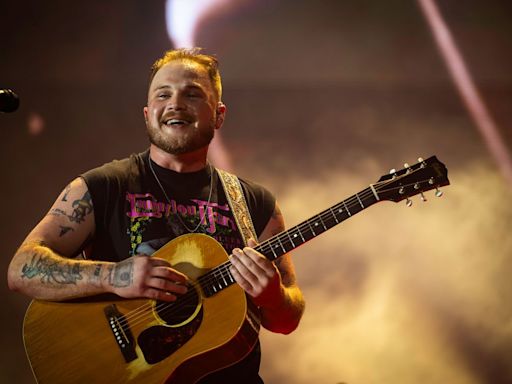 Zach Bryan Plays It Cool as Fan Rushes Stage During New Orleans Concert