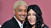 Cher locks lips with young beau on red carpet as she debuts nose ring