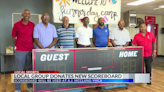 Local group donates scoreboard to A.J. McClung YMCA
