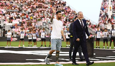 Injured Lionel Messi hobbles onto field to celebrate Copa America win