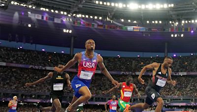 Team USA's Quincy Hall did snow angels on the track after his Paris Olympics 400m comeback victory