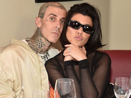 Kourtney Kardashian and Travis Barker Cuddle With Baby Rocky In Rare Family Photo - E! Online