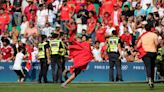 Olympic soccer gets off to violent and chaotic start as Morocco fans rush the field vs. Argentina